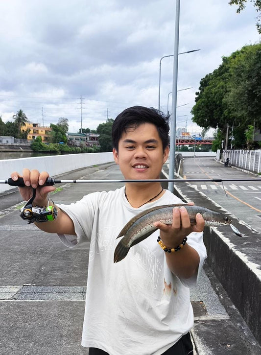 Malaysian Angler Andy Ng trying out his newly acquired rod and reel from us and landing a nice snakehead - Ryoshi Pro Outfitters