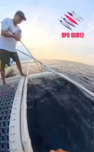 Angler Les Nunez landing a dogtooth tuna using his favorite jig, the Ryoshi Pro Outfitters original design OU812 Jig - Ryoshi Pro Outfitters